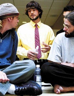 Incumbent ASUNM Senator Matt Beck, center, talks with Bryan Evans, a representative for Students Organizing Action for Peace, left, and Defend Democracy's Jedrek Lamb about his views after his speech during the Candidate Endorsement Forum for ASUNM Senate