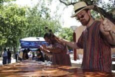 John Bartlit, right, and Steven Chavez of the New Mexican Marimba Band perform north of the SUB at the 2nd Annual Mexican Traditional Medicine Fair on a Mexican buzz marimba on Friday.