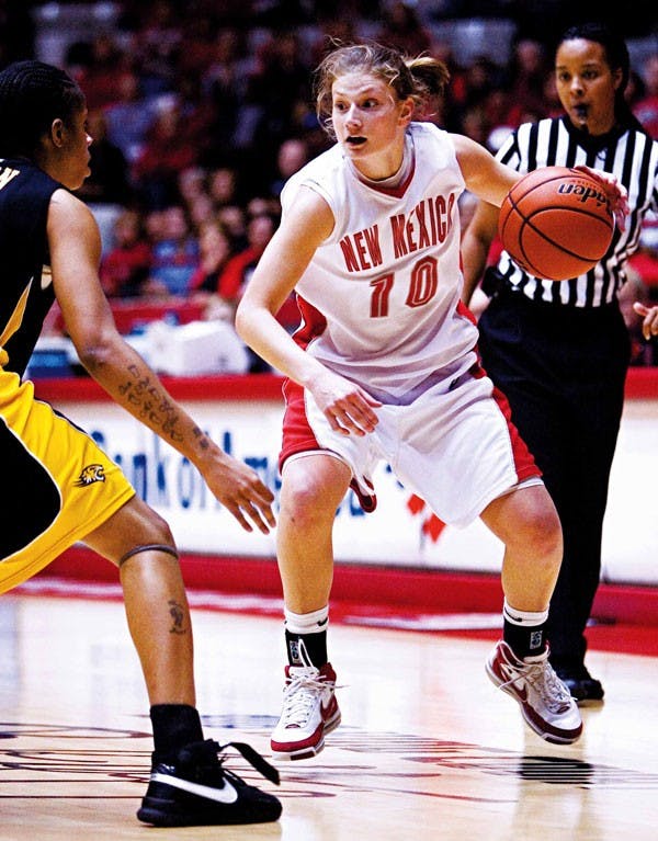UNM's Amy Beggin drives down court during Saturday's 76-63 win against Towson University at The Pit.