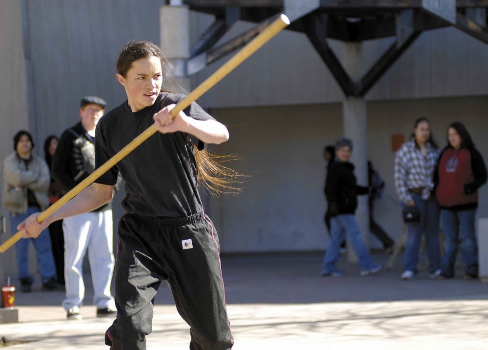 Aaron McIntire, 16, demonstrates a martial arts exercise as part of the World Language Expo next to Ortega Hall on Saturday. 