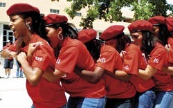 Members of the new UNM sorority Delta Sigma Theta march to the front of the stage before their introduction during the multicultural Cinco de Mayo celebration in front of the SUB on Friday. 