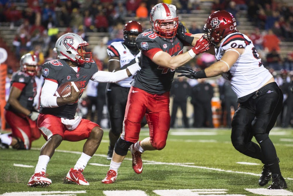 New Mexico quarterback Lamar Jordan (13) attempts to avoid being tackled by a San Diego State defenseman during the Oct. 10 game. The Lobos host Boise State Saturday at 5 p.m.
