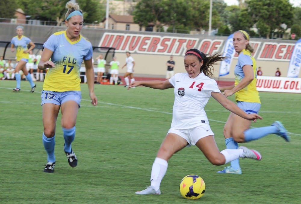 Sophomore midfielder Claire Lynch clears the ball away from Fort Lewis during Monday evening's exhibition at the UNM Soccer Complex. UNM won 3-1.
