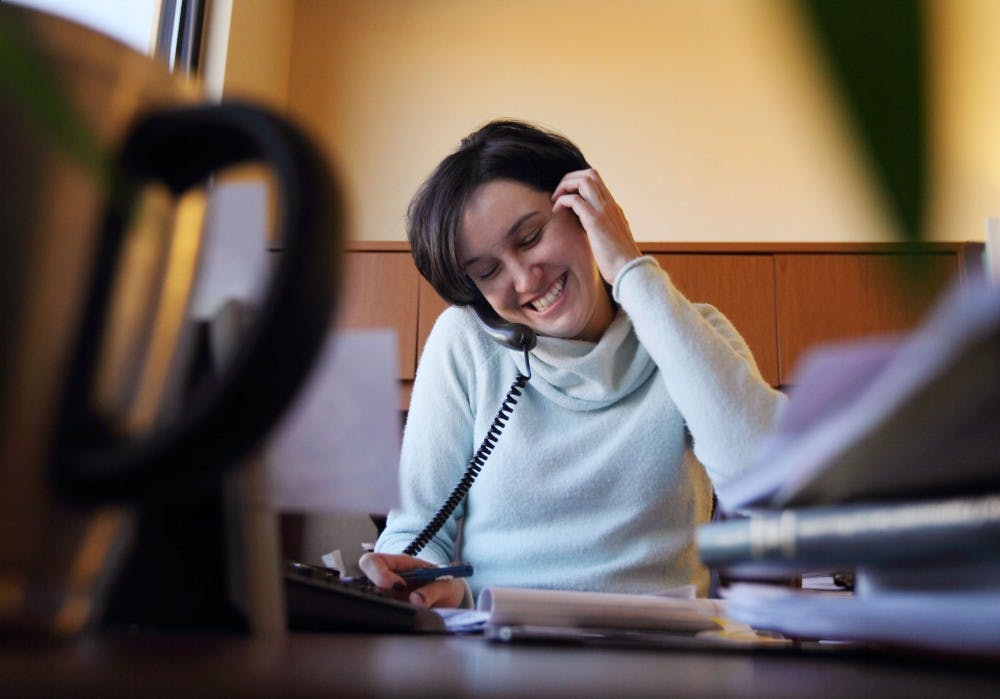 	Minerva Cook speaks with a client at Butt, Thornton &amp; Baehr Attorneys at Law on Monday. Cook graduated from the UNM School of Law in 2007. The School of Law is celebrating its 60th anniversary and is accepting nominations for memorable people, historic laws, events, legal cases or civic solutions. 