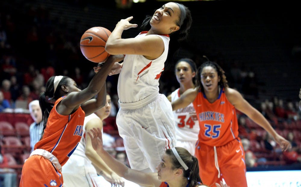 Sophomore guard Jayda Bovero goes through Houston Baptist's defense on her way to a lay up at WisePies Arena Friday night. The Lobos beat the Huskies 65-57 in their season opener.&nbsp;