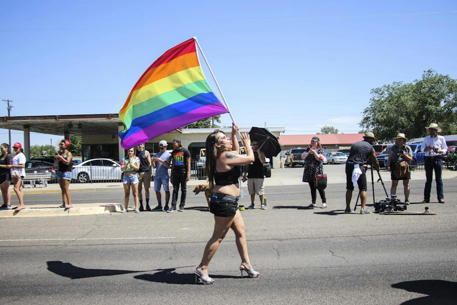 An Albuquerque Pride Parade participant marches with the Pride Flag on June 10, 2017. This year?s pride marked the parade?s 41st year.  