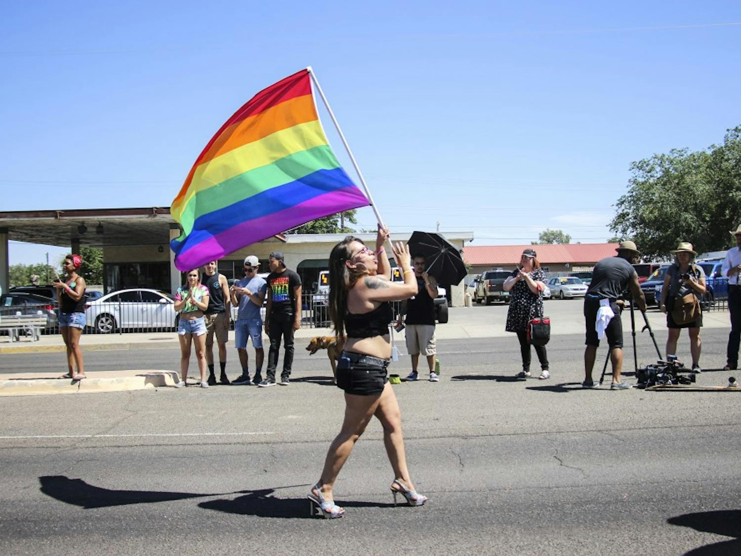 An Albuquerque Pride Parade participant marches with the Pride Flag on June 10, 2017. This year?s pride marked the parade?s 41st year.  