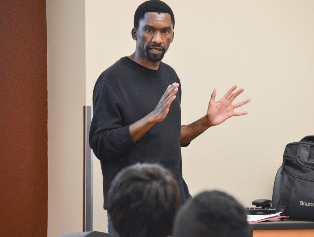 Webster Matjaka teaches the Hip Hop Music Culture class at UNM on Thursday night. This class teaches students about the political and artistic foundations of hip hop.