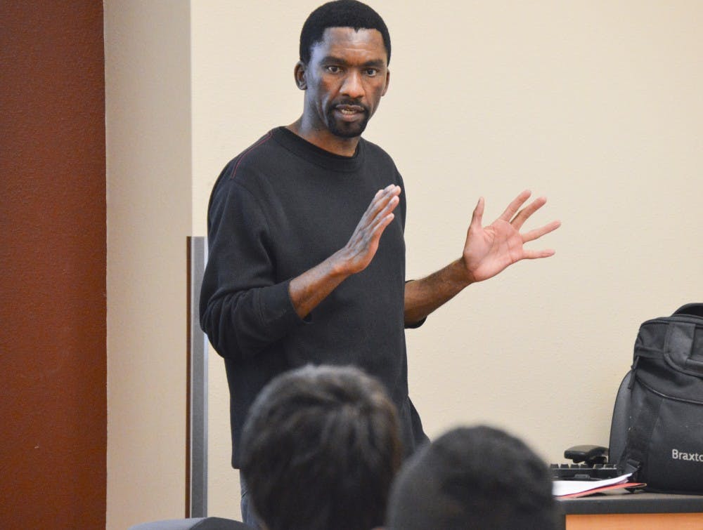 Webster Matjaka teaches the Hip Hop Music Culture class at UNM on Thursday night. This class teaches students about the political and artistic foundations of hip hop.
