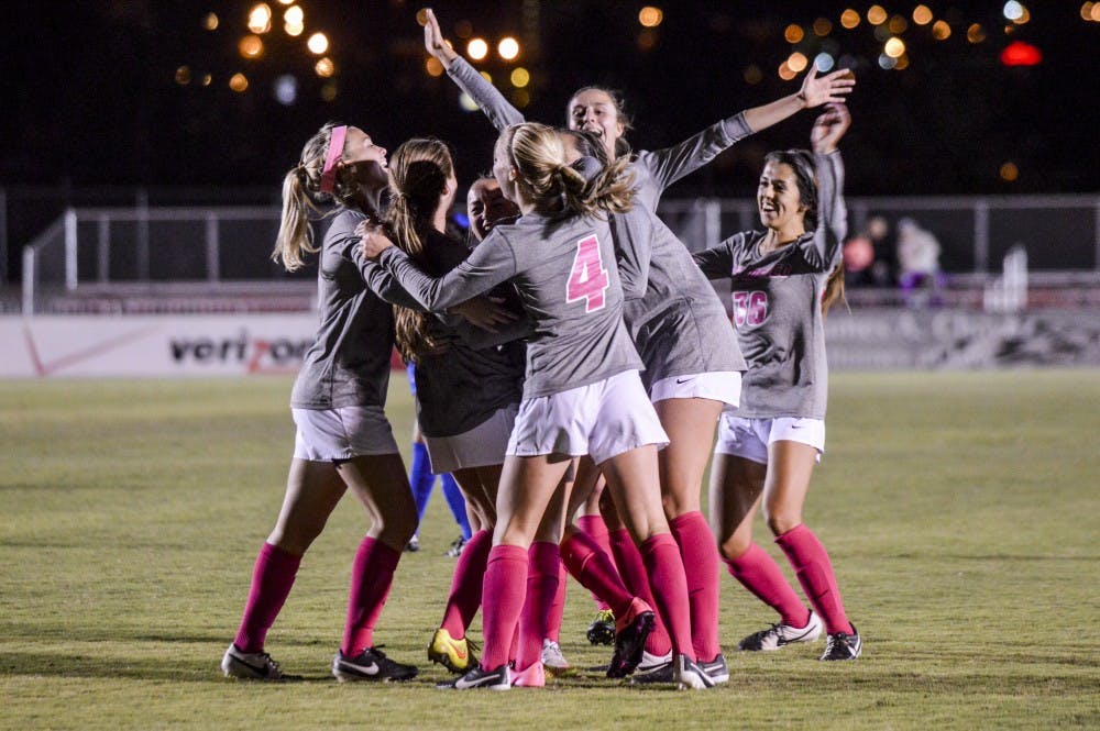 The women’s soccer team form together to celebrate their victory against San Jose State late in the fall 2015 season. The Lobos will play California University this Friday in Berkeley, California.