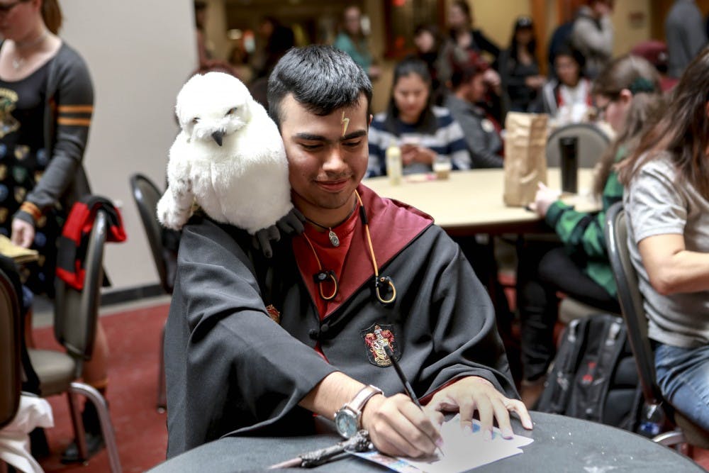 UNM student Noah Tijerina celebrates Harry Potter Day at UNM by dressing up in a Hogwarts gown on November 21, 2017.