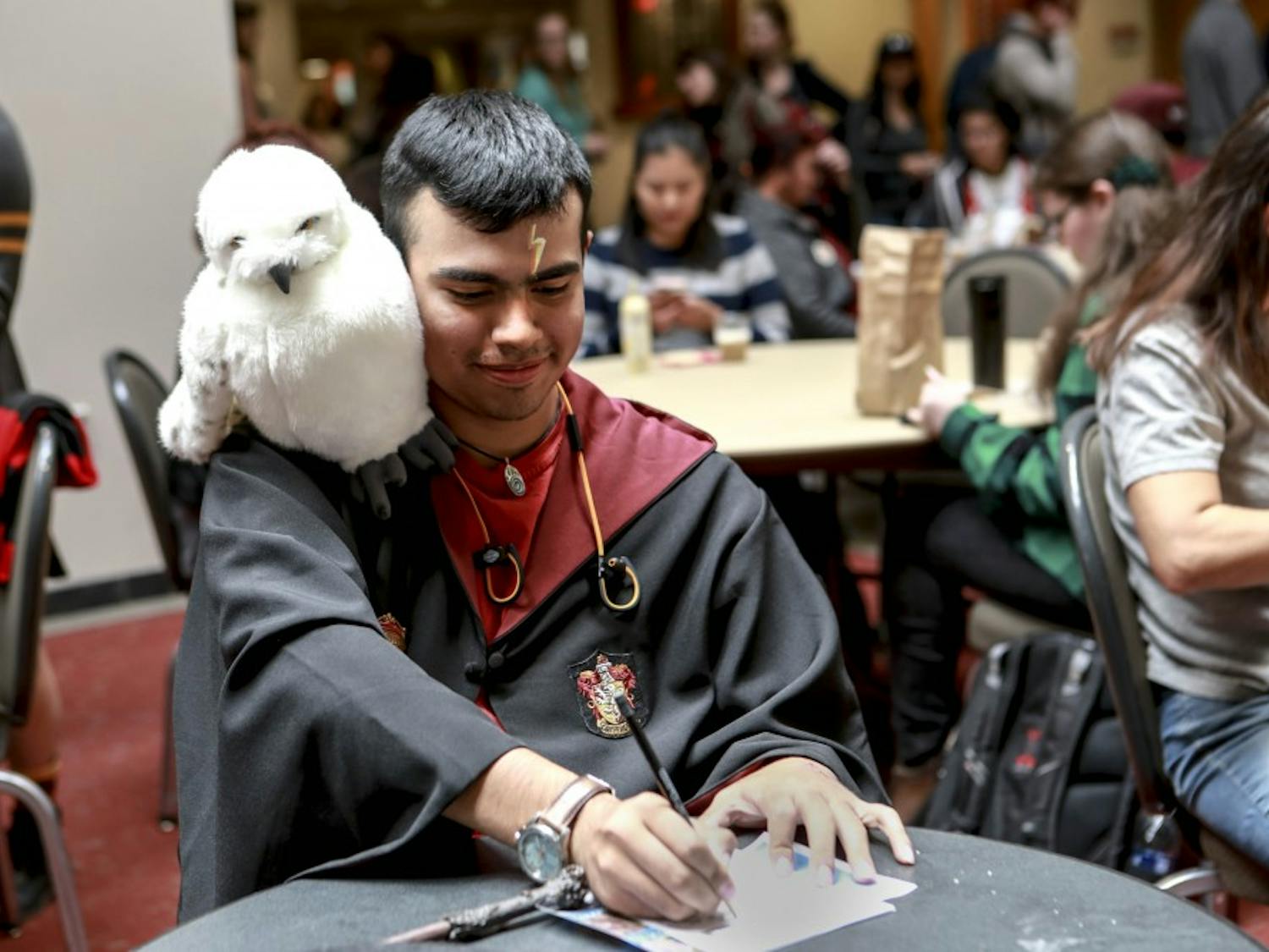 UNM student Noah Tijerina celebrates Harry Potter Day at UNM by dressing up in a Hogwarts gown on November 21, 2017.
