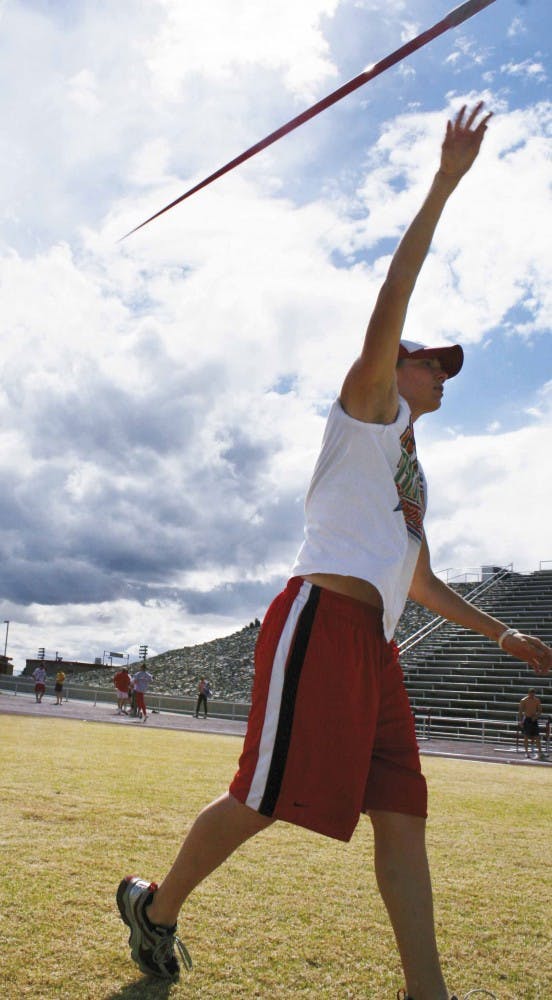 Katie Coronado throws a javelin during practice Thursday at the UNM Track Complex. 