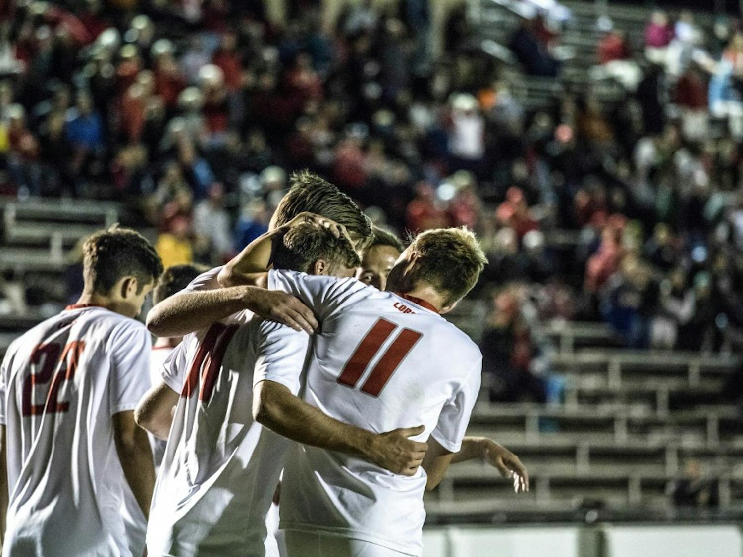 The UNM soccer team celebrates after a goal against University of Alabama Birmingham on Saturday, Oct. 14, 2017. The Lobos defeated UAB 2-0.