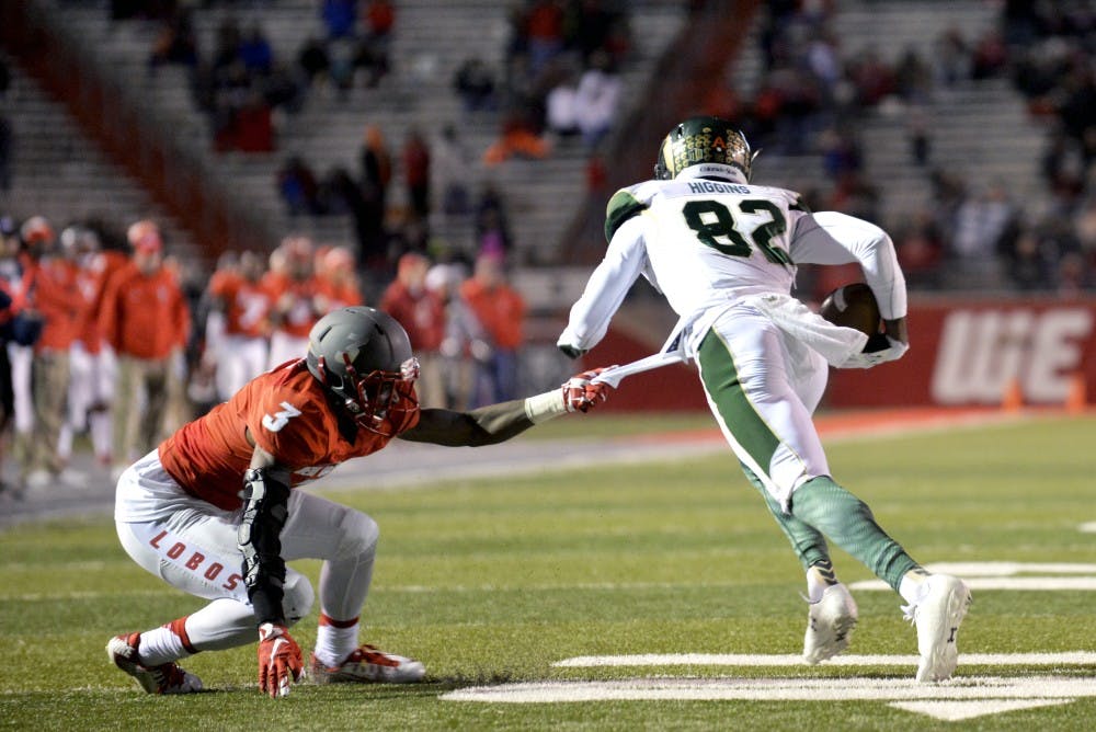 Senior cornerback Cranston Jones tries to bring down CSU's Rashard Higgins at University Stadium Saturday night. The Lobos lost to the Rams 28-21 and lost their chance to make it to the Mountain West Championships.&nbsp;