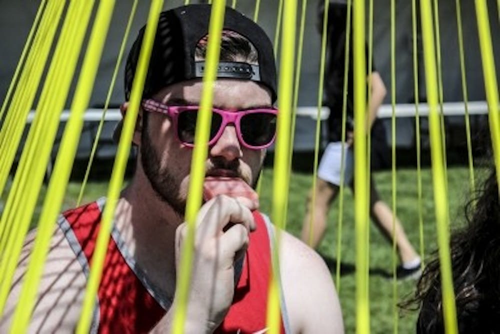 Aidan Donahue enjoys a popsicle at Fiestas on April 8, 2018 at Johnson Field.