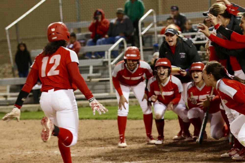 Senior Mariah Rimmer runs home after hitting a home run to celebrate with the team. The Lobos won 13-6 agains Utah State