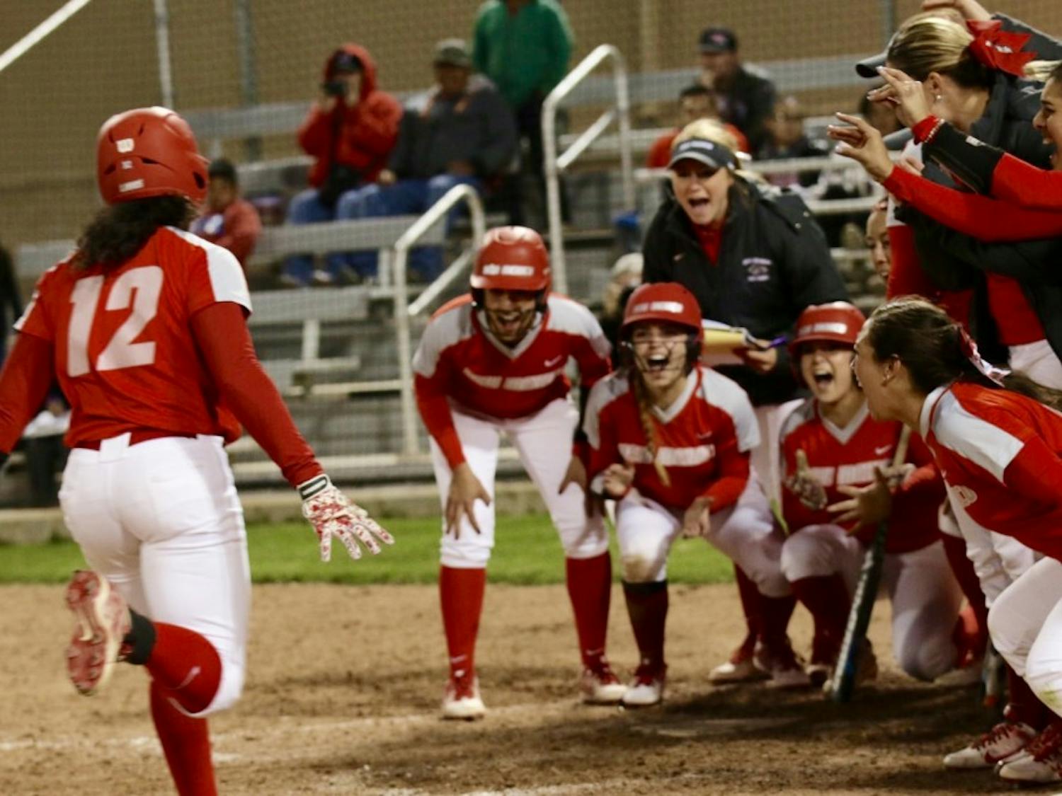 Senior Mariah Rimmer runs home after hitting a home run to celebrate with the team. The Lobos won 13-6 agains Utah State
