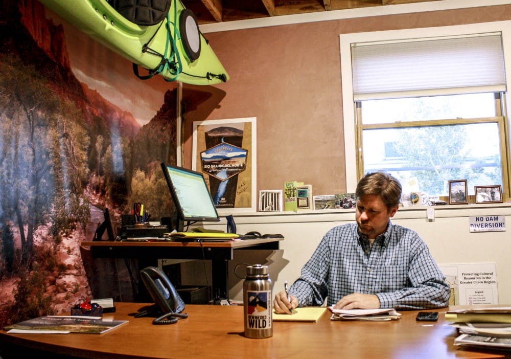 Executive Director of the New Mexico Wilderness Alliance, Mark Allison, works in his office on Nov. 8, 2017. The New Mexico Wilderness Alliance is the parent partner of UNM’s Wilderness Alliance made up of mostly UNM students.