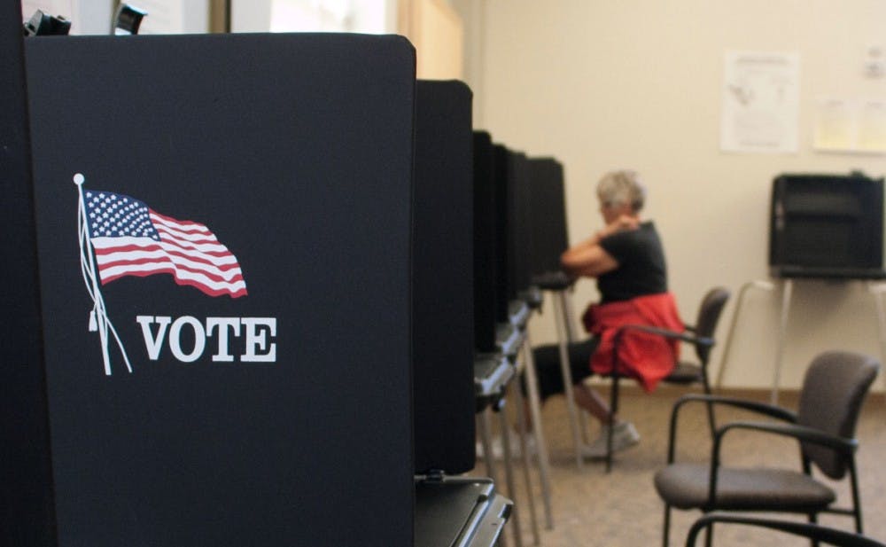 	A voter ponders her picks at an early voting site in the SUB on Saturday. The site is one of 16 early voting locations in Bernalillo County open until Oct. 30th. 
