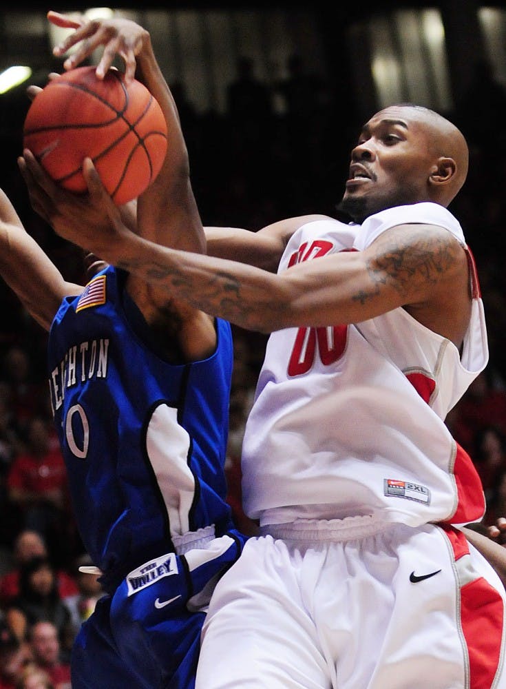 	Lobo forward A.J. Hardeman wrestles the ball away from Creighton’s Antoine Young in this file photo. Hardeman, who was named the Mountain West Conference player of the Week, is the third men’s basketball player to achieve the honor this season.