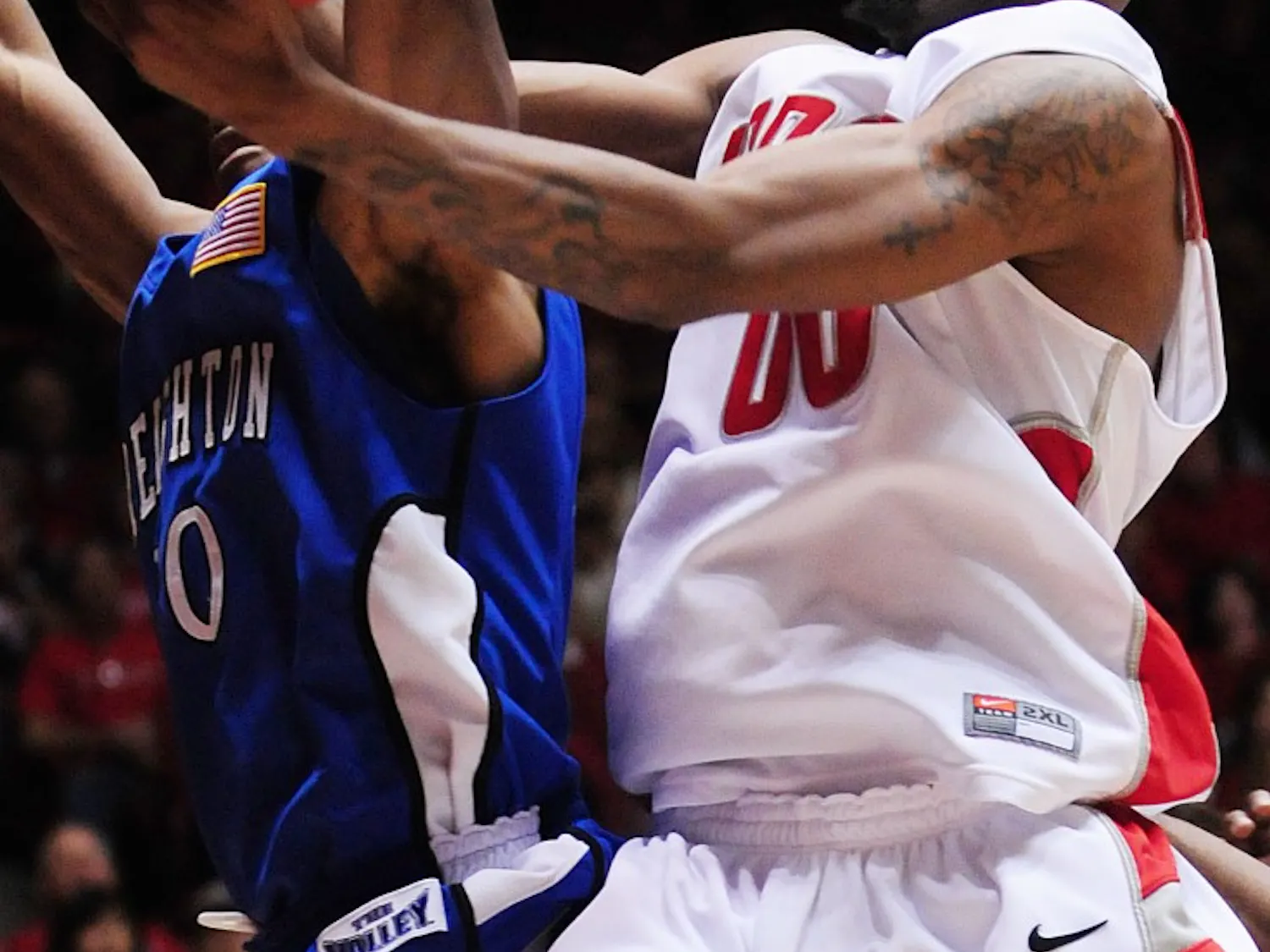Lobo forward A.J. Hardeman wrestles the ball away from Creighton’s Antoine Young in this file photo. Hardeman, who was named the Mountain West Conference player of the Week, is the third men’s basketball player to achieve the honor this season.