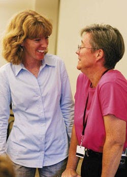 Shelley Rael, the senior clinical nutritionist for UNM's Employee Health Promotion Program, left, listens to Biggest Loser Challenge participant Miranda Eastham talk about her surprise at winning first place during Wednesday's awards ceremony in the SUB.