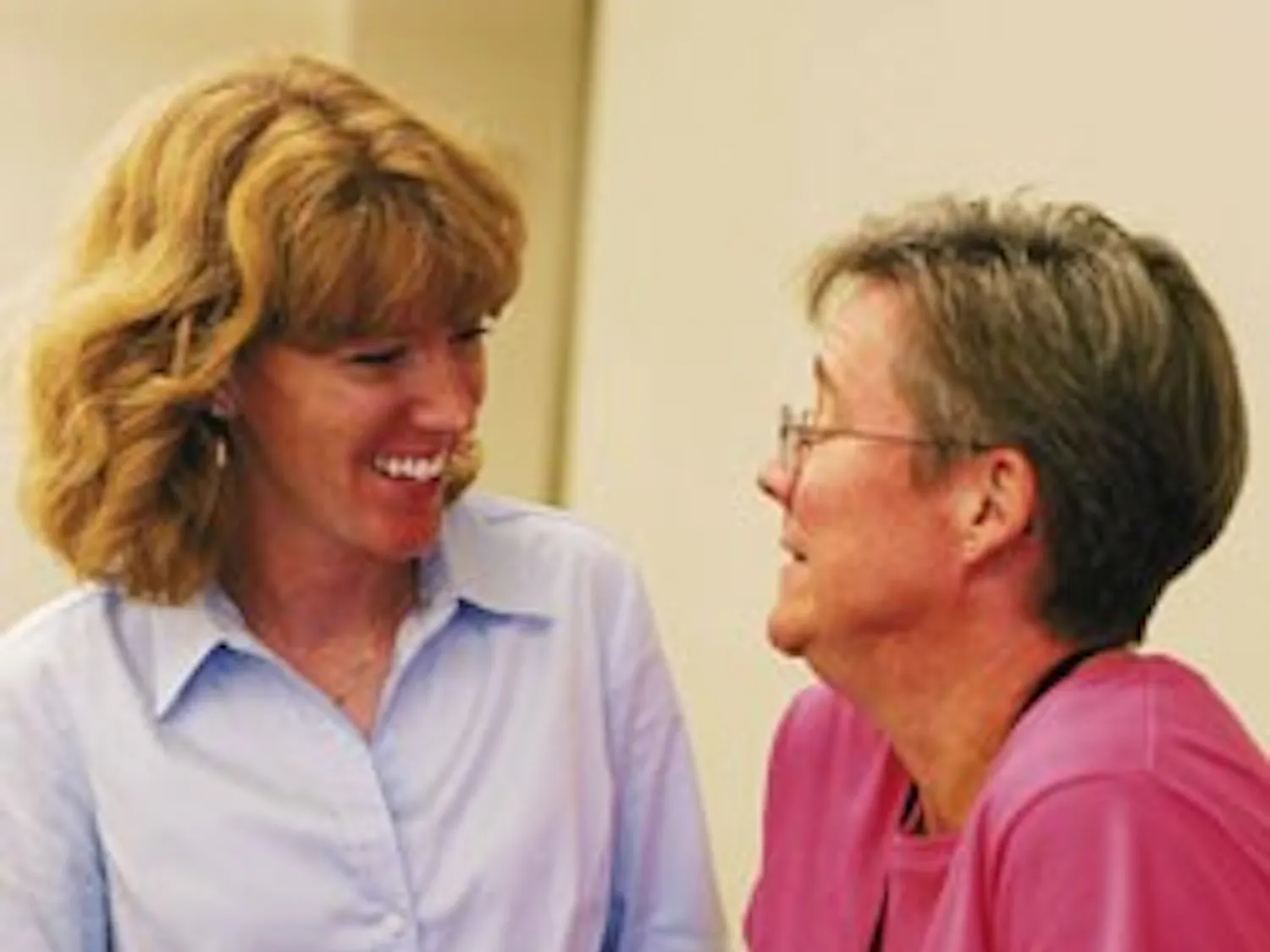Shelley Rael, the senior clinical nutritionist for UNM's Employee Health Promotion Program, left, listens to Biggest Loser Challenge participant Miranda Eastham talk about her surprise at winning first place during Wednesday's awards ceremony in the SUB.