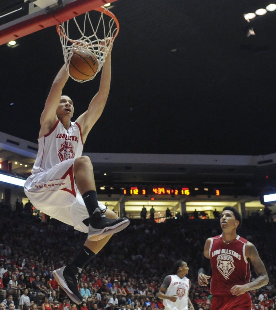 Former Lobo guard Phillip McDonald dunks the ball into the basket at the inaugural All Star-Game at the Pit on Sunday night. Former Lobos played against each other in this exhibition game that pitted the Cherry team against the Silver. Cherry won the game. 