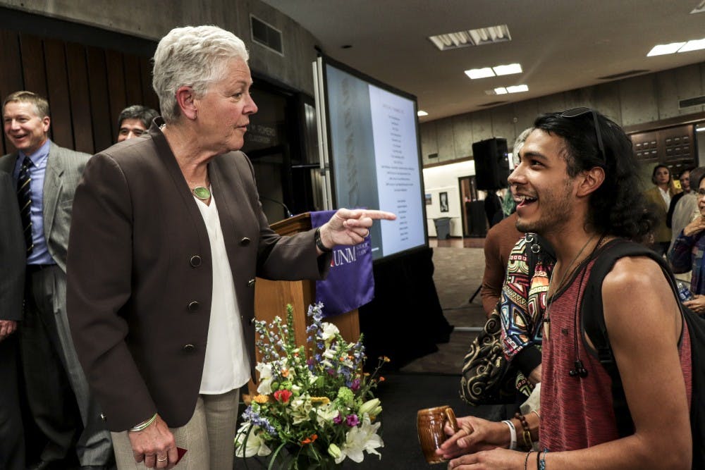 Gina McCarthy, the former EPA administrator under President Barack Obama, talks with students after her speech at the University of New Mexico Law School on April 25, 2018.
