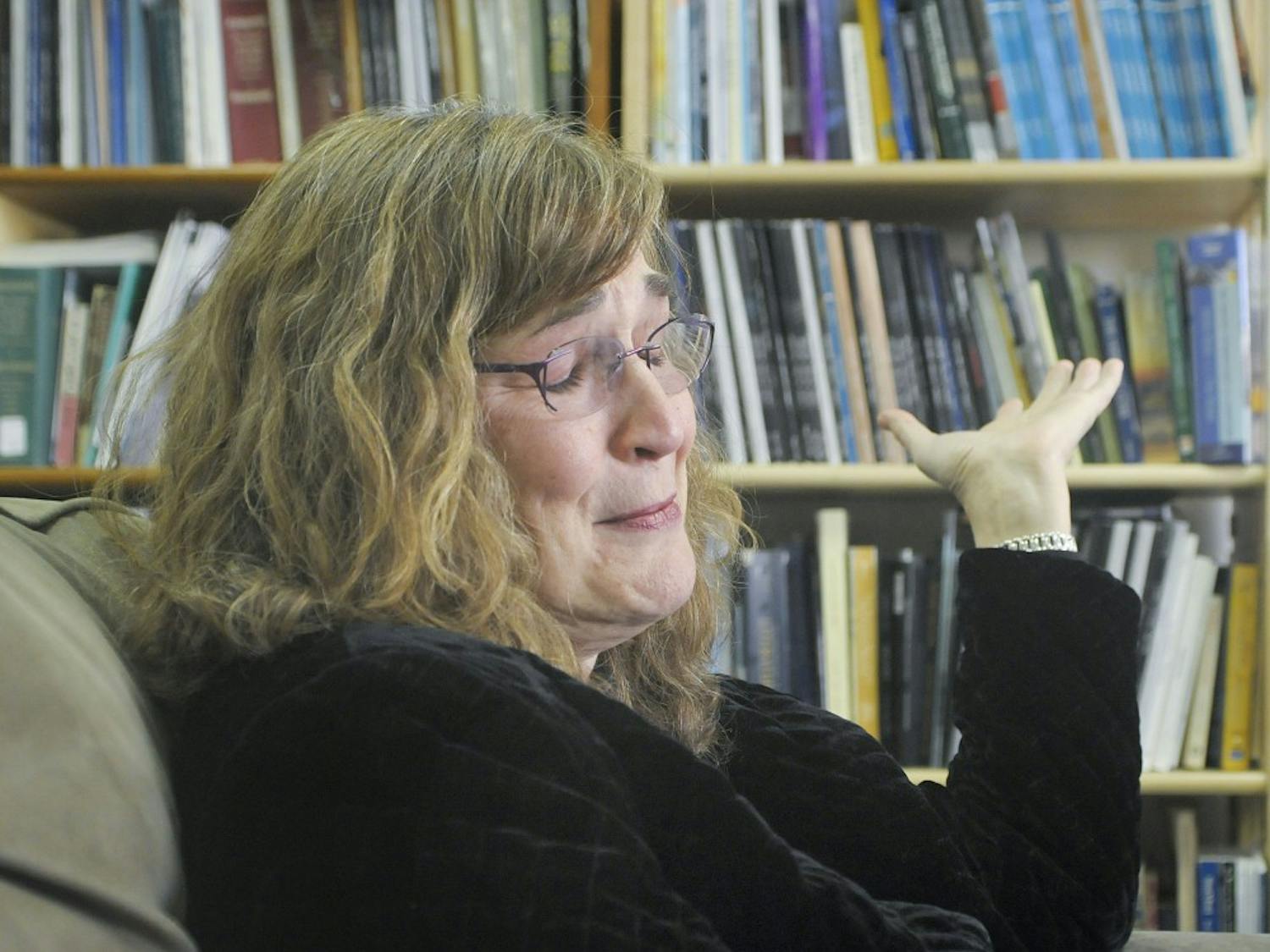 Gail Houston, chair of the English department chokes back tears when talking about her colleague, Hector Torres. Torres was killed along with his girlfriend Stephania Gray, a graduate student, in his home on Sunday.