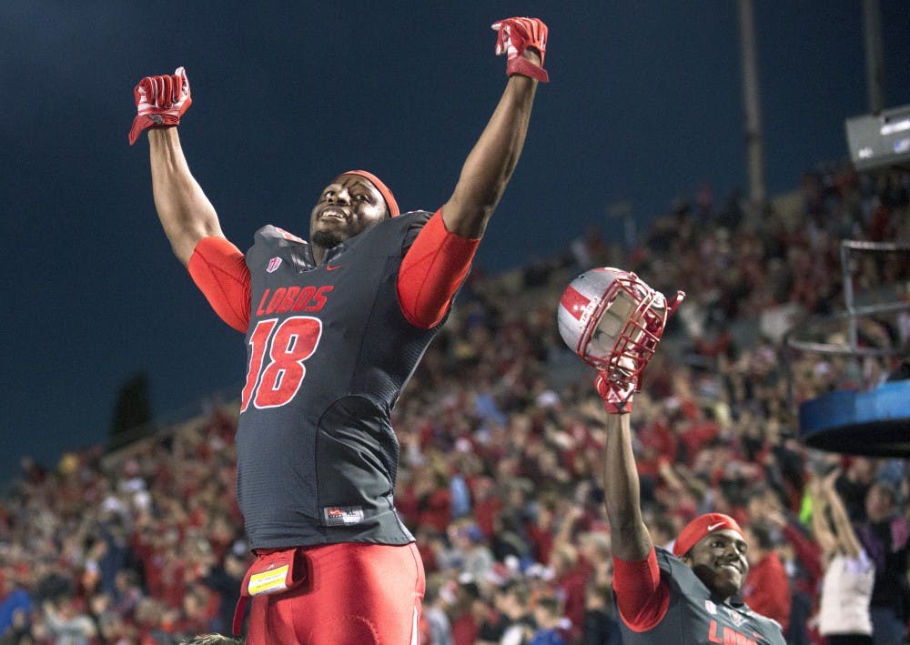 New Mexico linebacker Javarie Johnson and defensive back Ryan Santos celebrate a touchdown during the game against Boise State on Nov. 8. The Lobos will play their final home game on Saturday at 1 p.m. against Wyoming at University Stadium.