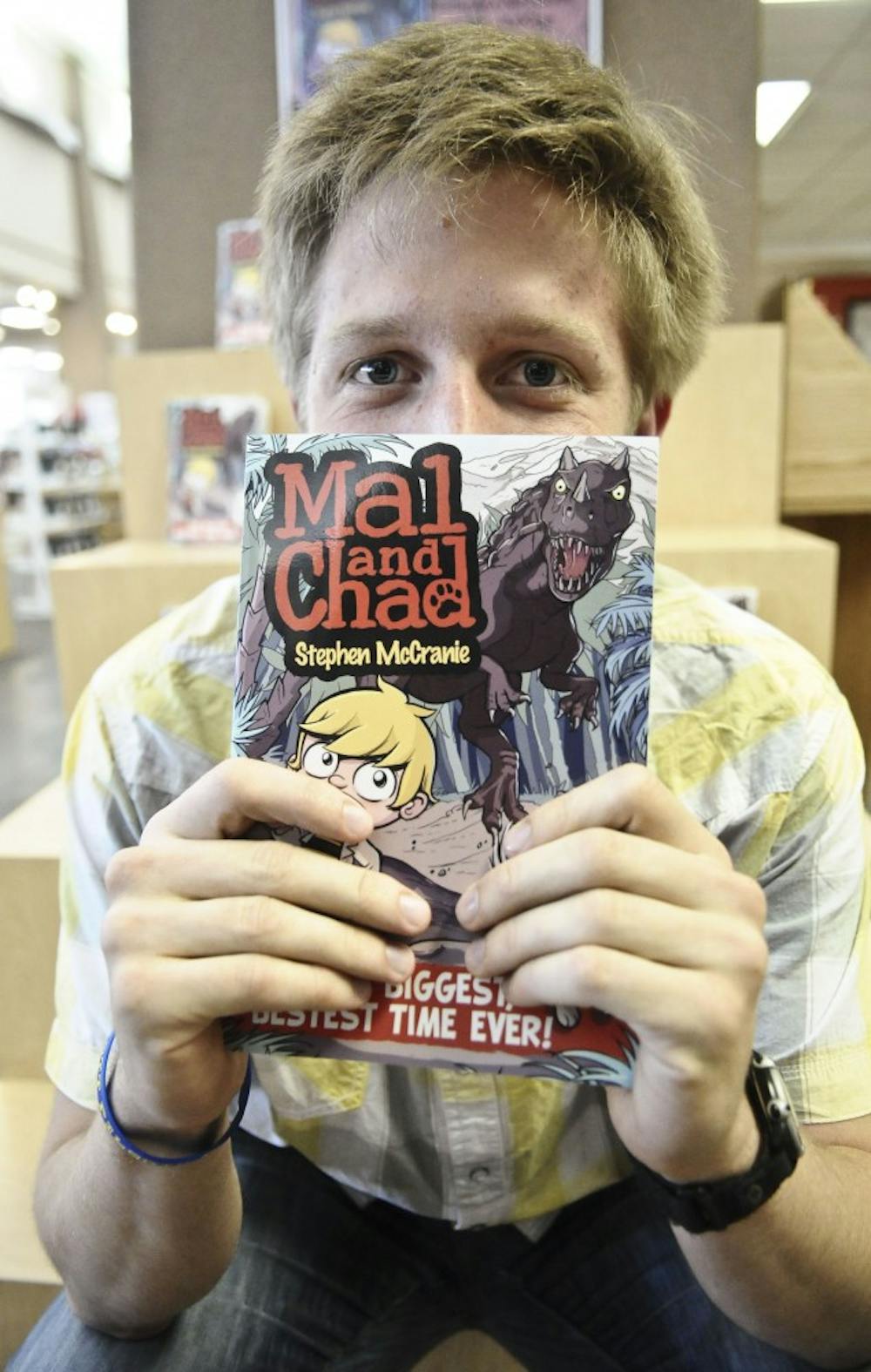 	Cartoonist Stephen McCranie shows off his first graphic novel, “Mal and Chad,” which was first printed in a Daily Lobo comic strip in 2007. The book is the first of three planned novels, and the UNM alumnus will host a book signing Saturday in the UNM Bookstore. 