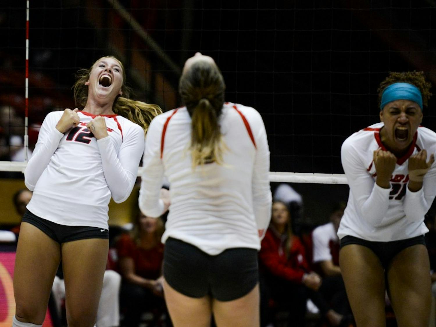 Senior outside hitter Cassie House, 12, celebrates with teammates after scoring against Nebraska on Saturday, Sept. 10, 2016 at WisePies Arena. UNM won three out of its four games this weekend at the UT Arlington Invitational.