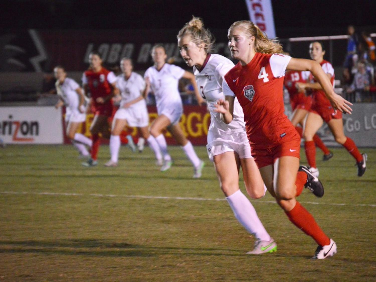 New Mexico midfielder Lindsey Guice (4) chases after the ball alongside a Florida State defender during their game Aug. 21 at the UNM Soccer Complex. Off to a 1-3 start, the Lobos host Idaho State at 2 p.m. Thursday.