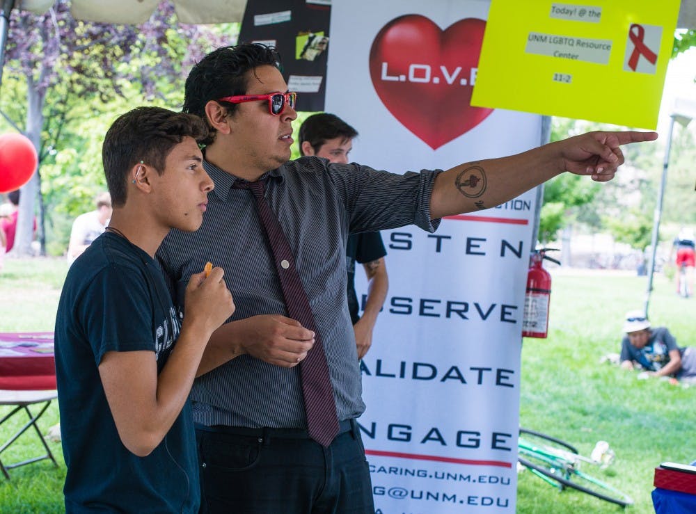 	Pedro Gutierrez, freshman anthropology major, and Frankie Flores, program assistant for the LGBTQ Resource Center, set up for UNM Community Day during the Welcome Back Days on Wednesday. UNM was recently ranked on Campus Pride’s LGBT-Friendly Campus Climate Index with a score of 4.5 out of 5 stars, the highest score in the state.