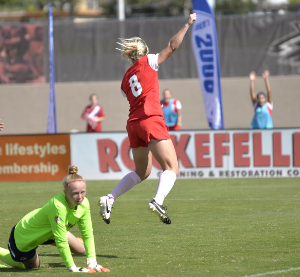 Lobos senior forward Korynn Blanksma jumps over Fresno States goal keeper after making a goal at the UNM Soccer Complex Sunday, Oct. 18. The Lobos play San Diego State Friday at 7 p.m..