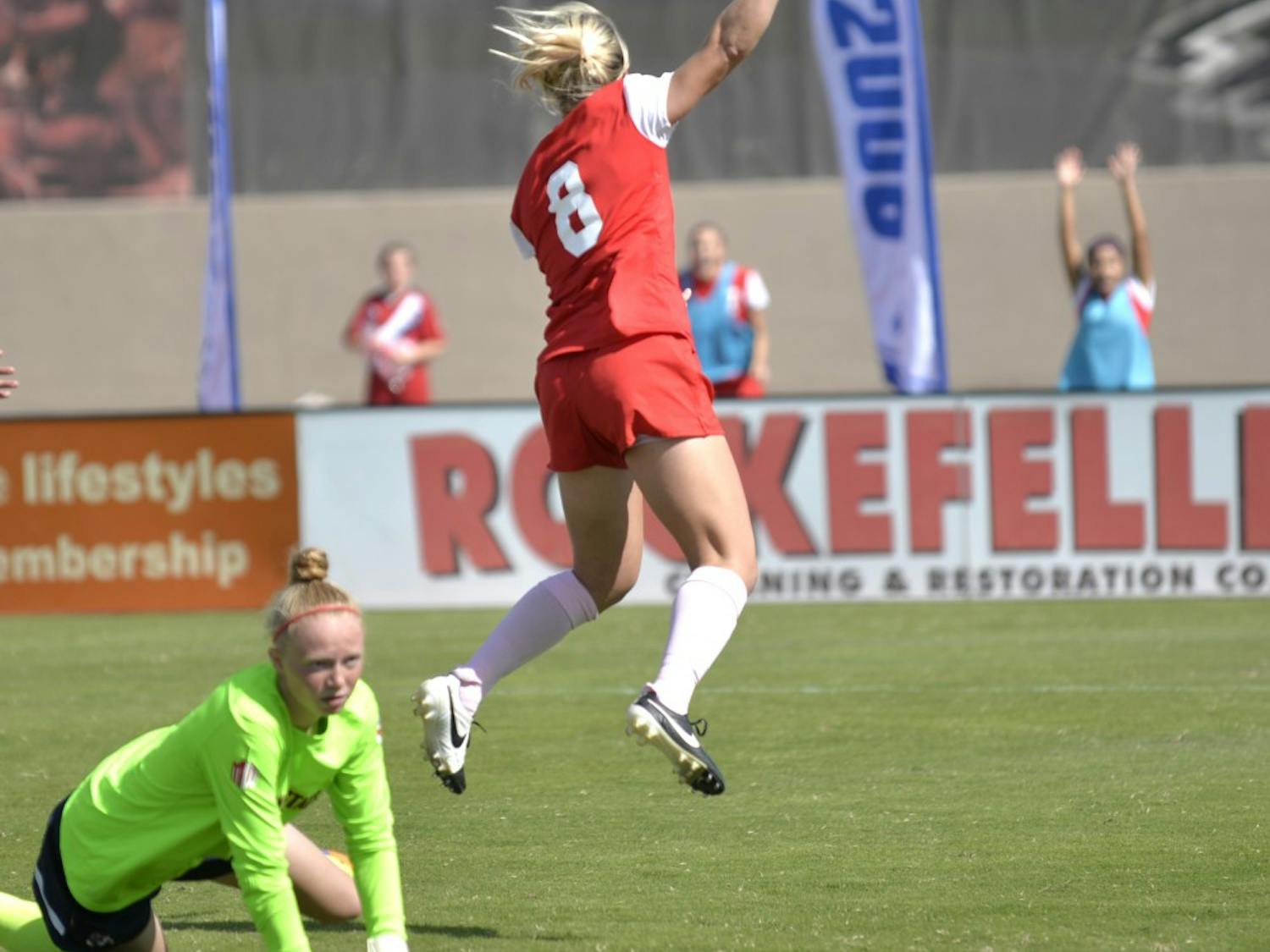 Lobos senior forward Korynn Blanksma jumps over Fresno States goal keeper after making a goal at the UNM Soccer Complex Sunday, Oct. 18. The Lobos play San Diego State Friday at 7 p.m..