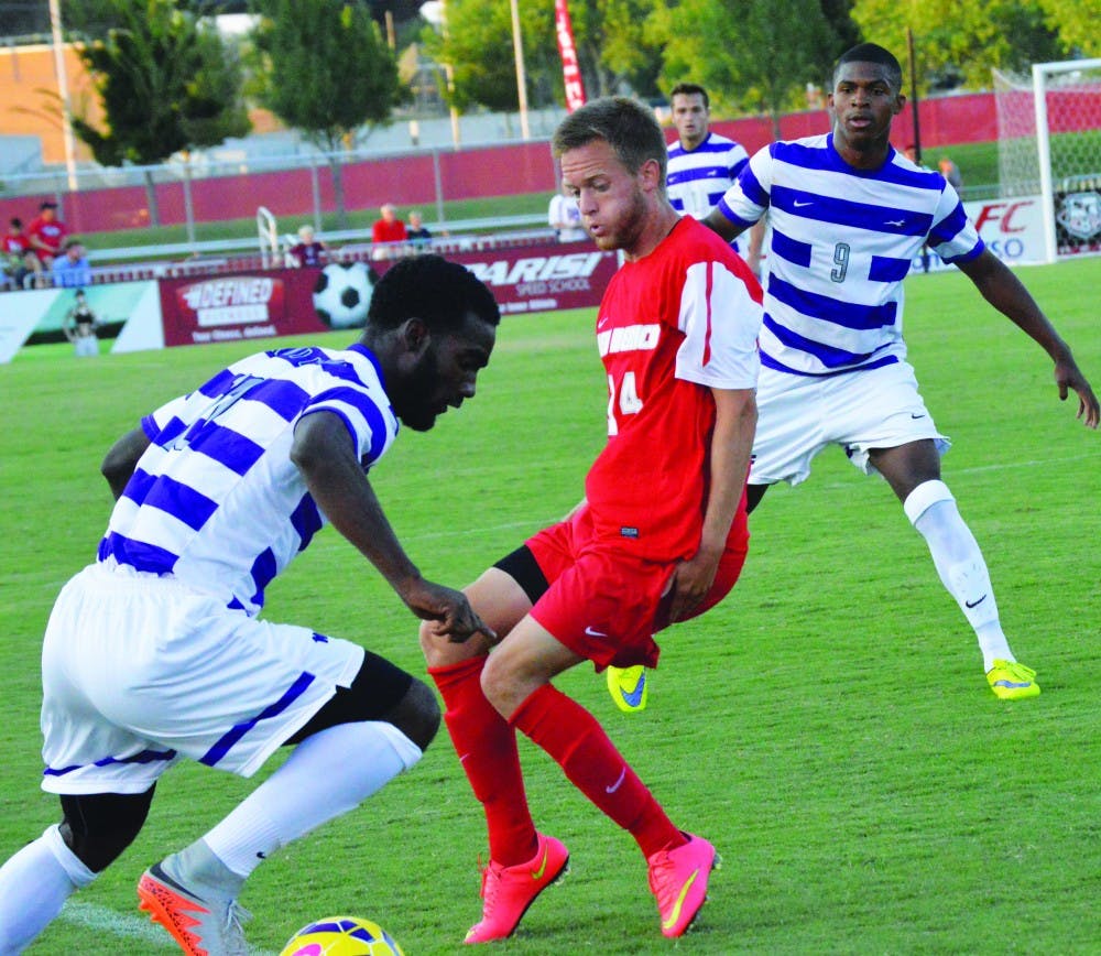 Chris Wehan shifts left to block a Grand Canyon player’s play on Aug. 19. The Lobos dropped their season opener to top-ranked UCLA on Saturday.