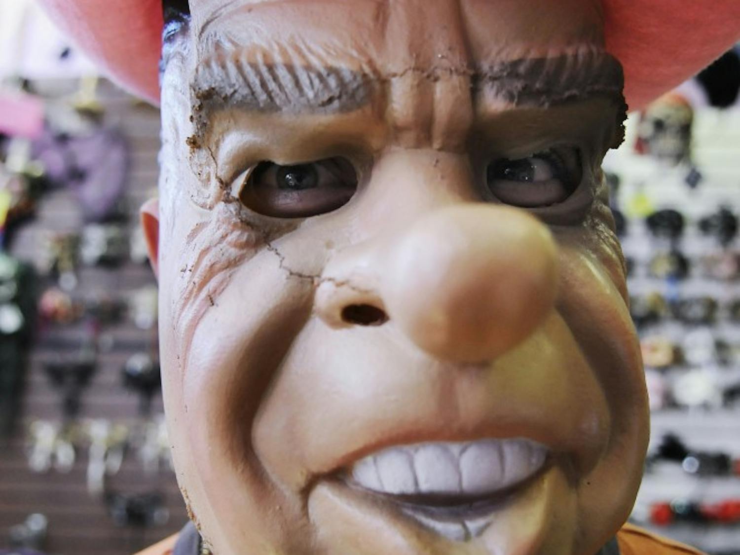 In this photo illustration, a man models a Richard Nixon Halloween mask. According to UNMPD, an alleged assailant wore a similar mask in an incident Oct. 1 in front of Parish Library.