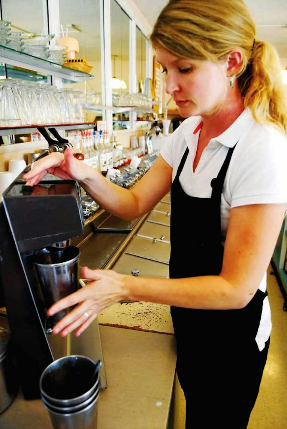 Waitress manager Rhonda Sumruld makes a milkshake Wednesday at Model Pharmacy.