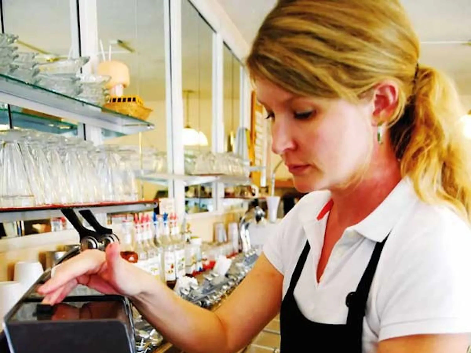 Waitress manager Rhonda Sumruld makes a milkshake Wednesday at Model Pharmacy.