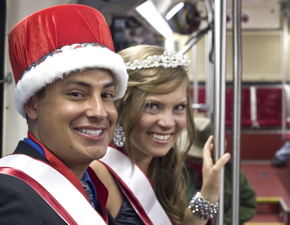 	Homecoming King and Queen Miguel Gonzales and Zoe Riebli wait for the Rapid Ride to leave the homecoming game after the third quarter. The Lobos lost their fifth game 38-20. See page 9 for football coverage. 

