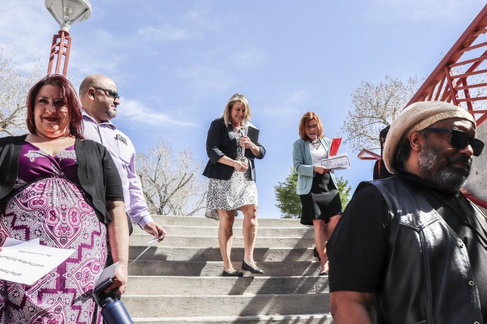 UNM President Stokes walks with faculty and other attendees for the vigil commemorating the 50-year anniversary of the assassination of civil rights leader Dr. Martin Luther King, Jr. on April 4, 2018.