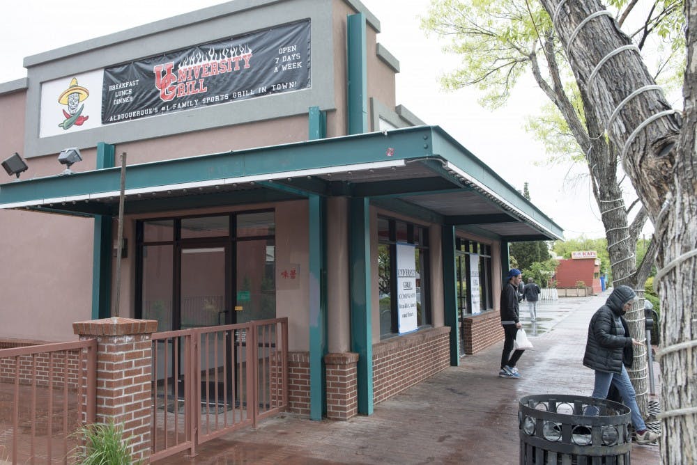 Passers-by walk past the University Grill on Sunday afternoon. The University Grill moved to a new location on 120 Harvard SE. The local restaurant had been located on Central Avenue, but a disagreement with the landlord caused University Grill owner Paul Kress to relocate the business two months after it opened. 