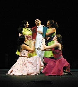 Joseph A. Wasson, center, plays the main character, Gomez, in a version of Ray Bradbury's "The Wonderful Ice Cream Suit" during a rehearsal Monday at the National Hispanic Cultural Center.