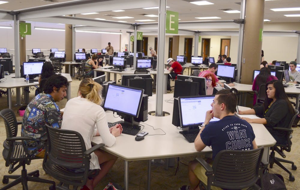 Students take a test in an online self-paced math class in the Math Learning Lab at Centennial Library Wednesday morning. The students can take the course at their own pace, with tutors available during every session. 