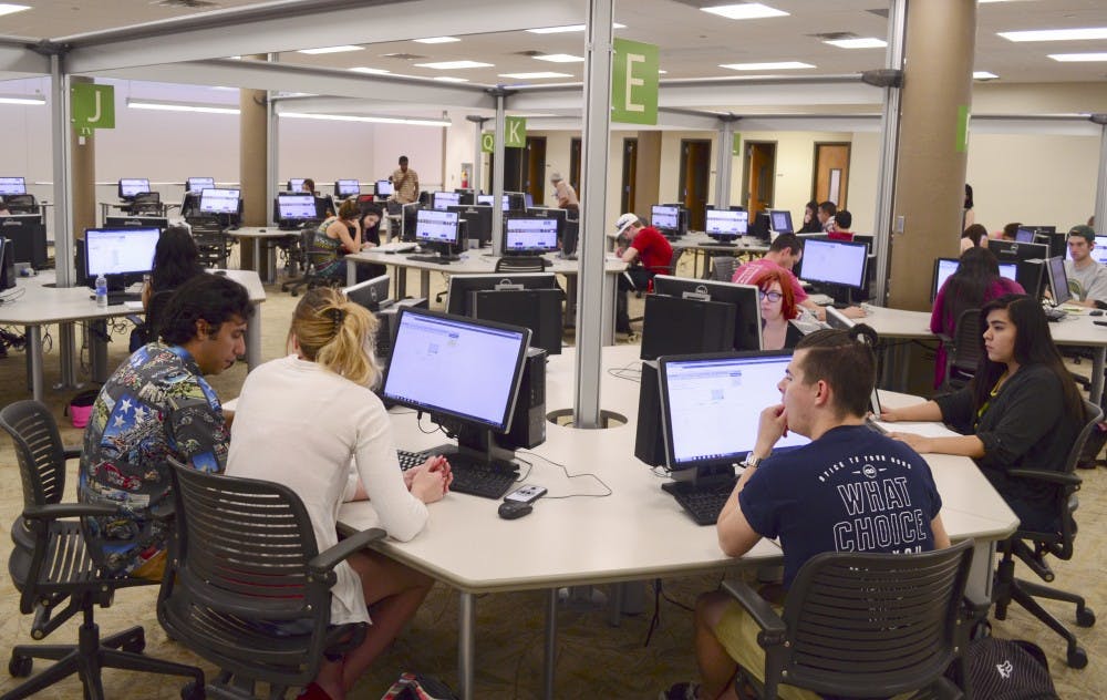 Students take a test in an online self-paced math class in the Math Learning Lab at Centennial Library Wednesday morning. The students can take the course at their own pace, with tutors available during every session. 
