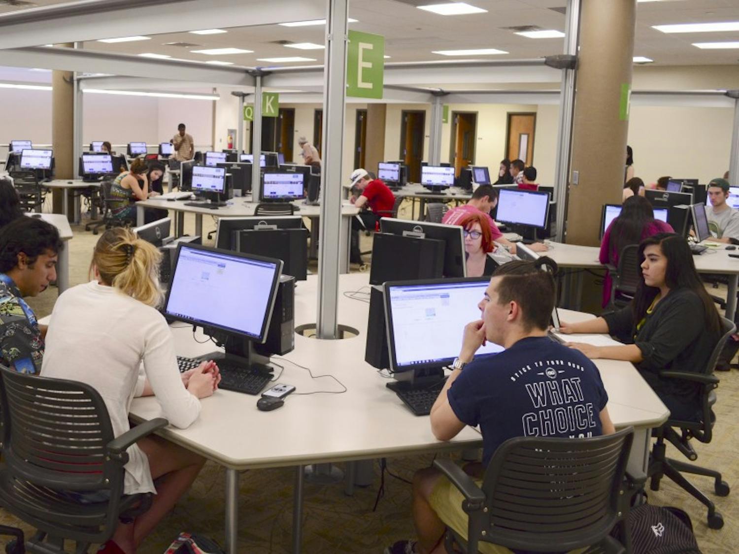 Students take a test in an online self-paced math class in the Math Learning Lab at Centennial Library Wednesday morning. The students can take the course at their own pace, with tutors available during every session. 
