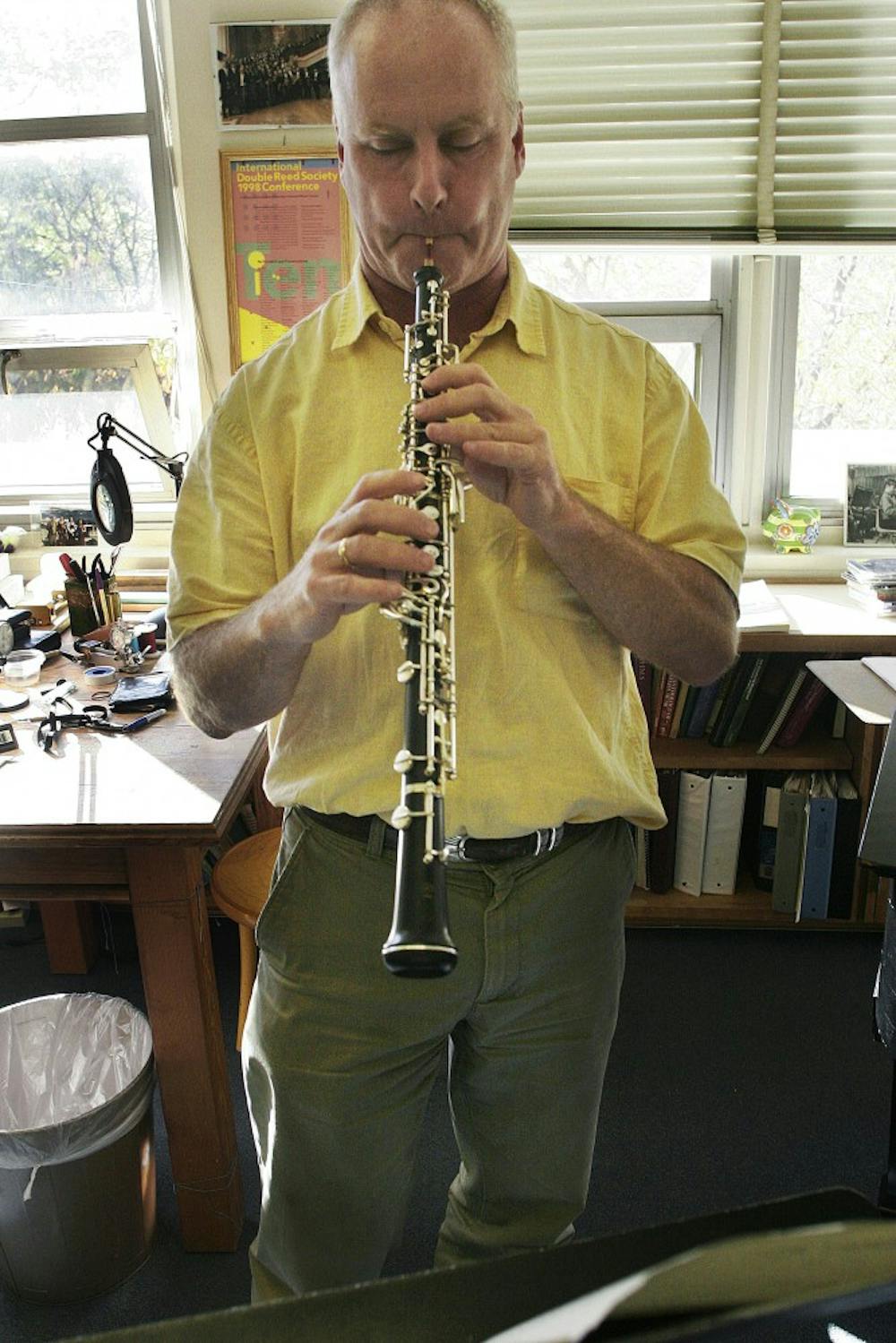 	Associate Professor Kevin Vigneau, a musician in the New Mexico Symphony Orchestra, plays Strauss’ Oboe Concerto in his office Monday. Vigneau is one of 13 UNM employees in the NMSO. The musicians are on strike because of a pay dispute.